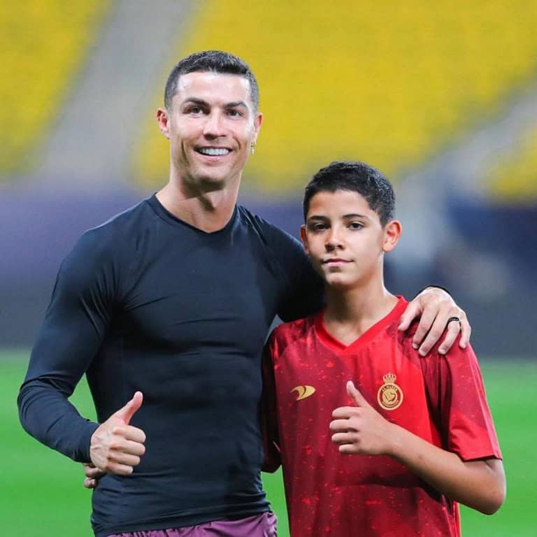Cristiano Ronaldo Jr with his father.